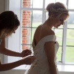 Bride getting into dress Bruisyard