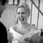 Bride laughing during ceremony