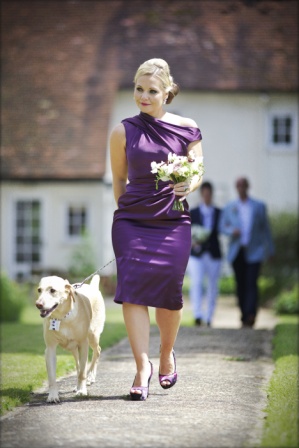 Bridesmaid in purple dress and best dog